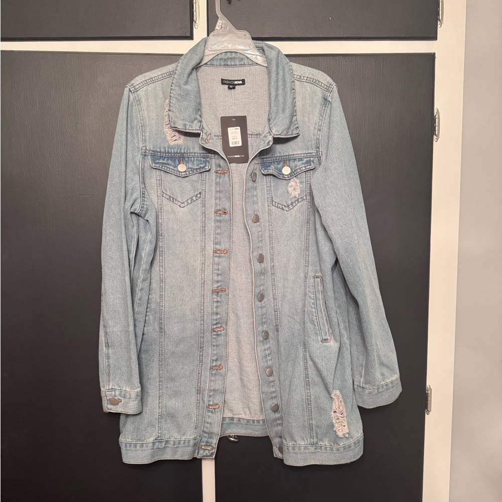 Women’s long length distressed denim jacket. NWT